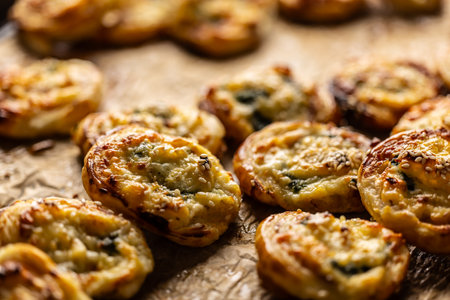 Mini pizza rolls stuffed with various ingredients, prosciutto bacon spinach basil mozzarella or parmesan cheese.の写真素材