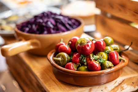 Canned hot peppers in a bowl on a restaurant buffet table.の写真素材