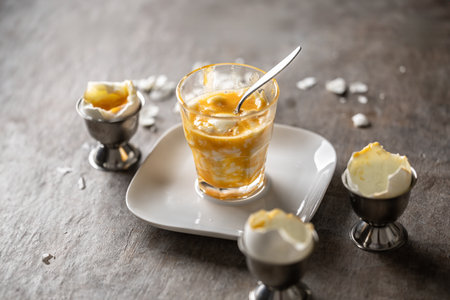 Soft-boiled eggs in a glass cup for breakfast.