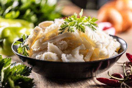 Precooked beef tripes in a bowl with vegetables and herbs ready for cooking.の写真素材