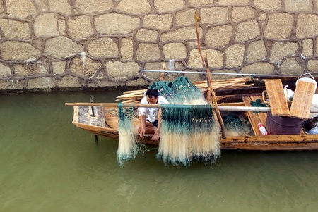 Higher angle view of a man sitting in the boatのeditorial素材