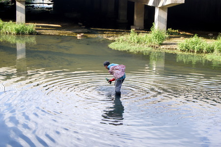 People walking at the riverのeditorial素材