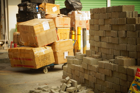 The large carton goods stacking, in commercial street, Shenzhen, Chinaのeditorial素材