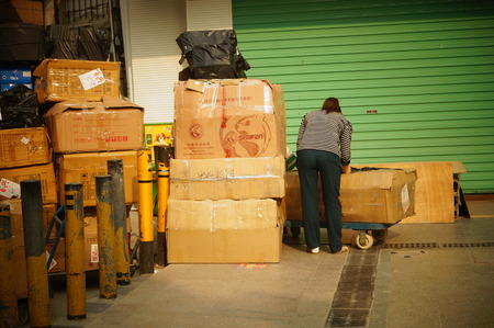 The large carton goods stacking, in commercial street, Shenzhen, Chinaのeditorial素材