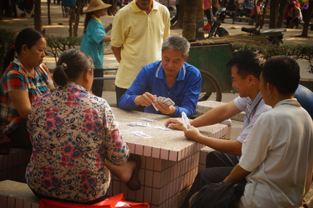 People in the park playing cards and leisure, in Shenzhen, Chinaのeditorial素材