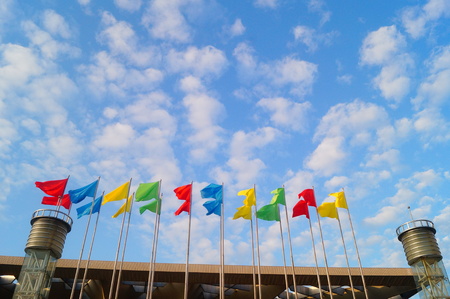 The color of the flag is the background of the blue sky and white clouds, very beautiful.