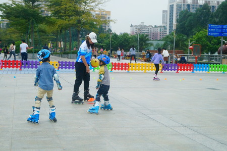 Children training for roller skating on the square in Shenzhen, China
