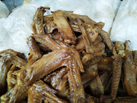 Fried chicken wings in the market. Thai food. Close up.の写真素材