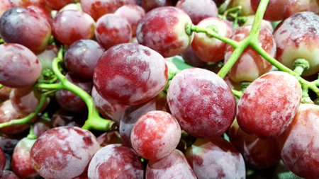 Red grapes in the market, close-up. Selective focus.の写真素材