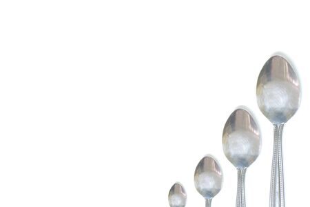 isolated steel teaspoon order by size (small to big) on white background have copy space for put text or objectの写真素材