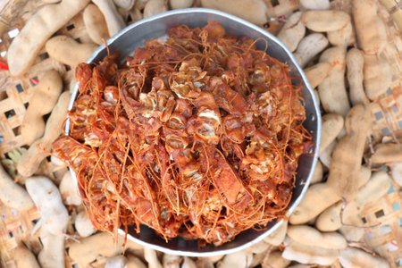 Close up details of ripe sour brown tamarind pile peeled tamarind seeds for make soggy tamarind, top viewの写真素材