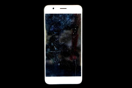 White cellphone on black background have scratches on film that protect screen mobile
