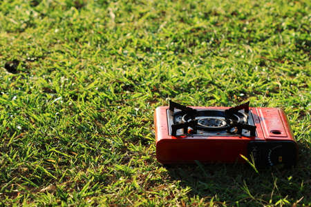 Gas stove on grass background for camping have copy spaceの写真素材