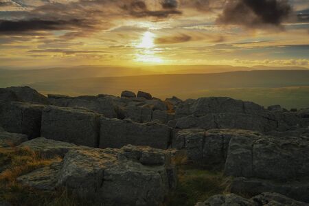 Stunning sunset from the rocky outcrop at the top of Great Whernside overlooking Wharfedale,...