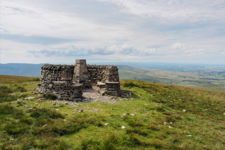 Wild Boar Fell summit and triangulation point enclosed by a circle of dry stone walls, Eden Valley, Cumbria, UKの写真素材