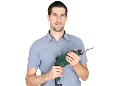 Attractive young man holding an electric drillの写真素材
