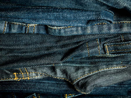 Stack of jeans Backgroundの写真素材