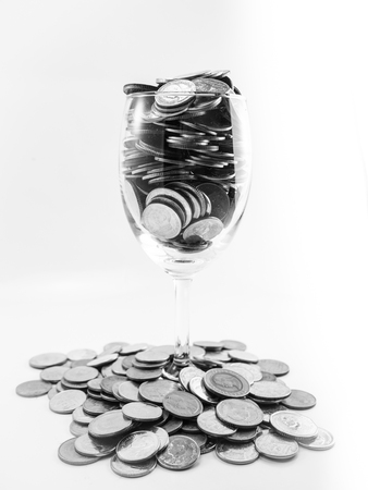 coin in wine glasses black and white colourの写真素材