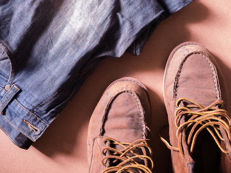 blue jean with still life of old leather boots, work harder men style