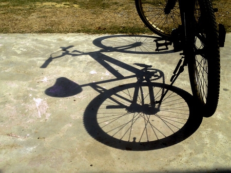 bicycle shadow on groundの写真素材