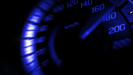 Close up shot of a speed meter in a car with blue light speed at 180 Km/H in concept racing carの写真素材