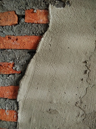 texture of plaster surface on red brick wall in house building ,plasterer craftmanshift construction siteの写真素材