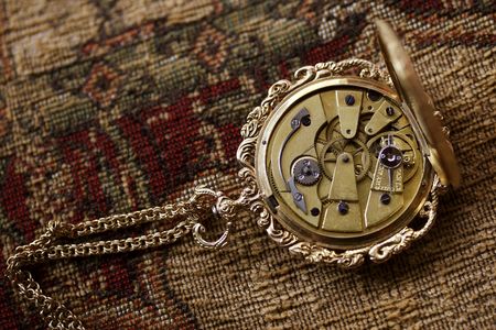 antique ladies watch with clockwork mechanism exposed