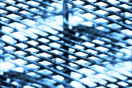 rusty, worn, metal grid pattern repeatの写真素材