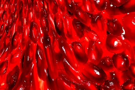fresh pomegranate arils as cascading background abstract