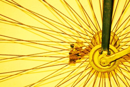 antique high wheel bicycle as abstract backgroundの写真素材