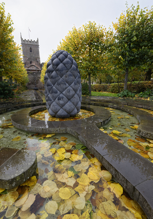 Autumn Leaves in Water Feature 'Beside the still waters' by Peter Randal Page, Castle Park, Bristol, UKのeditorial素材