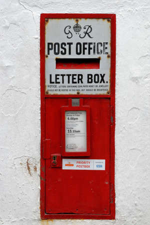 George VI  Post Box in the wall of Porlock Post Office, Somerset, UKの写真素材