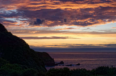 Sunset on Lee Bay and Crock Point, Exmoor, Devon, UKの写真素材
