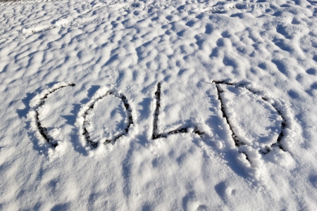 The word  Cold  carved into fresh white snowの写真素材