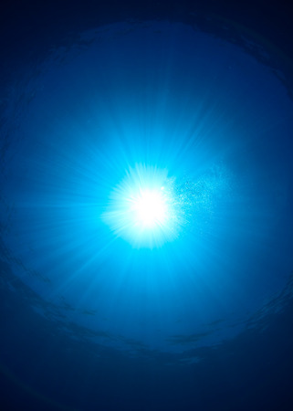 Sunburst on the oceans surfaceの写真素材
