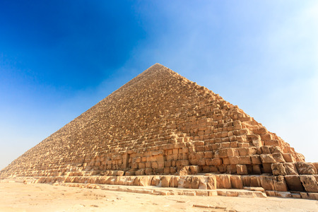 The Great Pyramid in Giza surrounded by early morning smog in Cairoの写真素材
