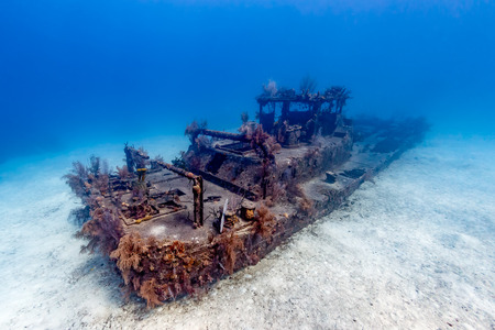 An old, small shipwreck lying on the seabedの写真素材