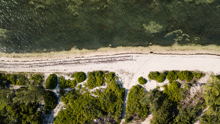 Aerial view of a remote, empty tropical beachの写真素材