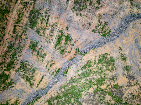 Aerial drone view of deforestation of a tropical rain forest to make way for palm oil and constructionの写真素材