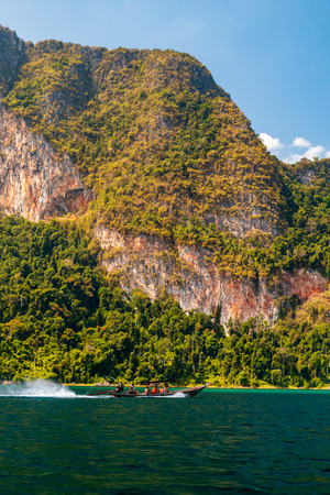 Beautiful Cheow Lan lake surrounded by cliffs and jungleの写真素材