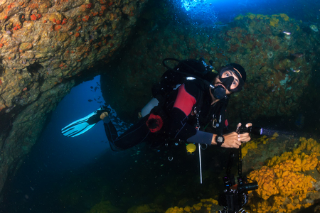 SCUBA diver in an underwater tunnelの写真素材