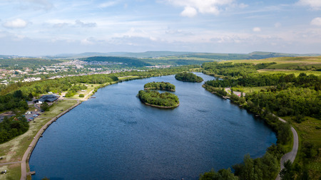 Aerial view of Bryn Bach park and lake in Tredegar, South Walesの写真素材