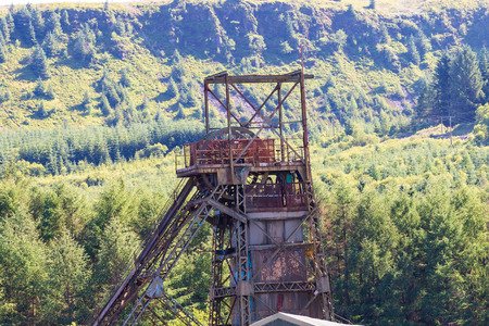 Wheel and winch system of a long since closed and abandoned coal mine (Tower Colliery, Wales)の写真素材