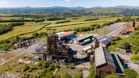 Aerial drone view of a closed, abandoned coal mine (Tower Colliery, South Wales)の写真素材
