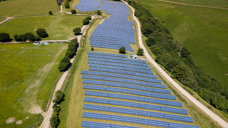 Aerial drone view of a solar energy farm on a mountainside (South Wales)の写真素材