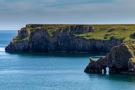 Dramtic coastline scenery consisting of arches and limestone cliffs (West Wales)