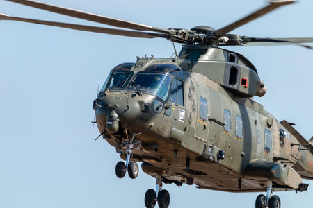 RNAS YEOVILTON, ENGLAND - July 07, 2018: A Royal Navy Merlin HC3 helicopter with troops on fastropes...