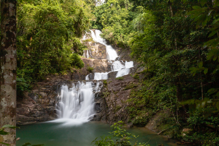 A multi level waterfall and cascade in a tropical rainforestの写真素材
