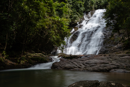 Beautiful waterfall flowing through a tropical rain forest in Thailand (Ton Prai, Lam Ru, Thailand)の写真素材