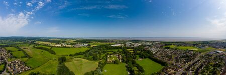 Aerial panorama of Caldicot Castle and both Severn Bridges in the background